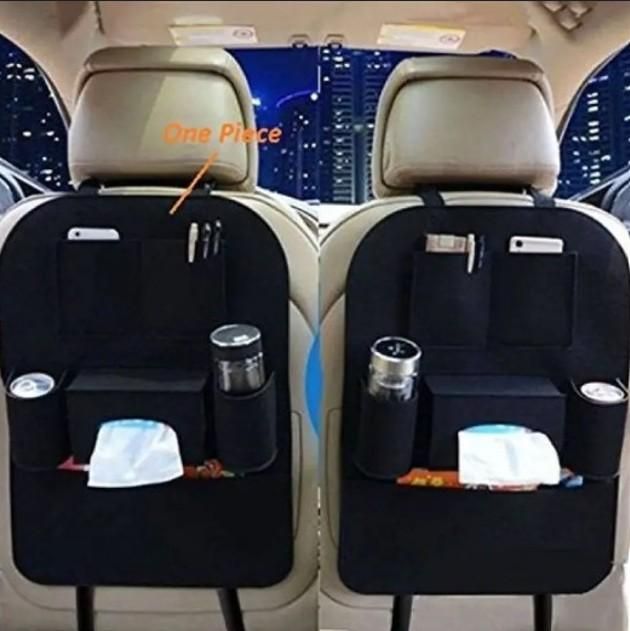 Car seat organizer with multiple pockets and cup holders on a car seat.